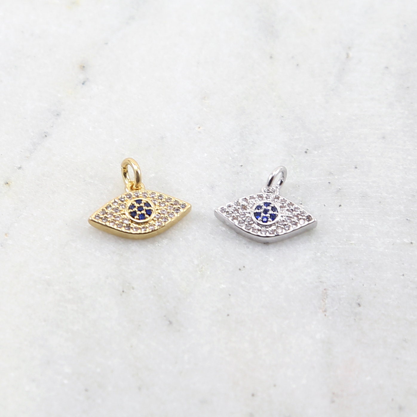Rhodium Plated Pave CZ with Blue Stone Center Evil Eye Protector