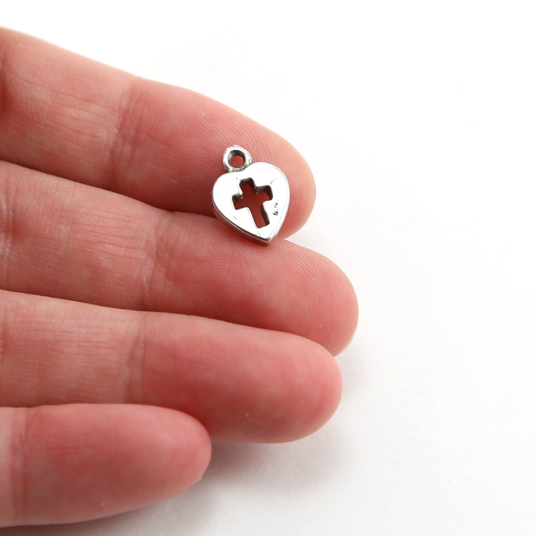Sterling Silver Tiny Heart with Cross Cut Out Charm in Dainty Heart