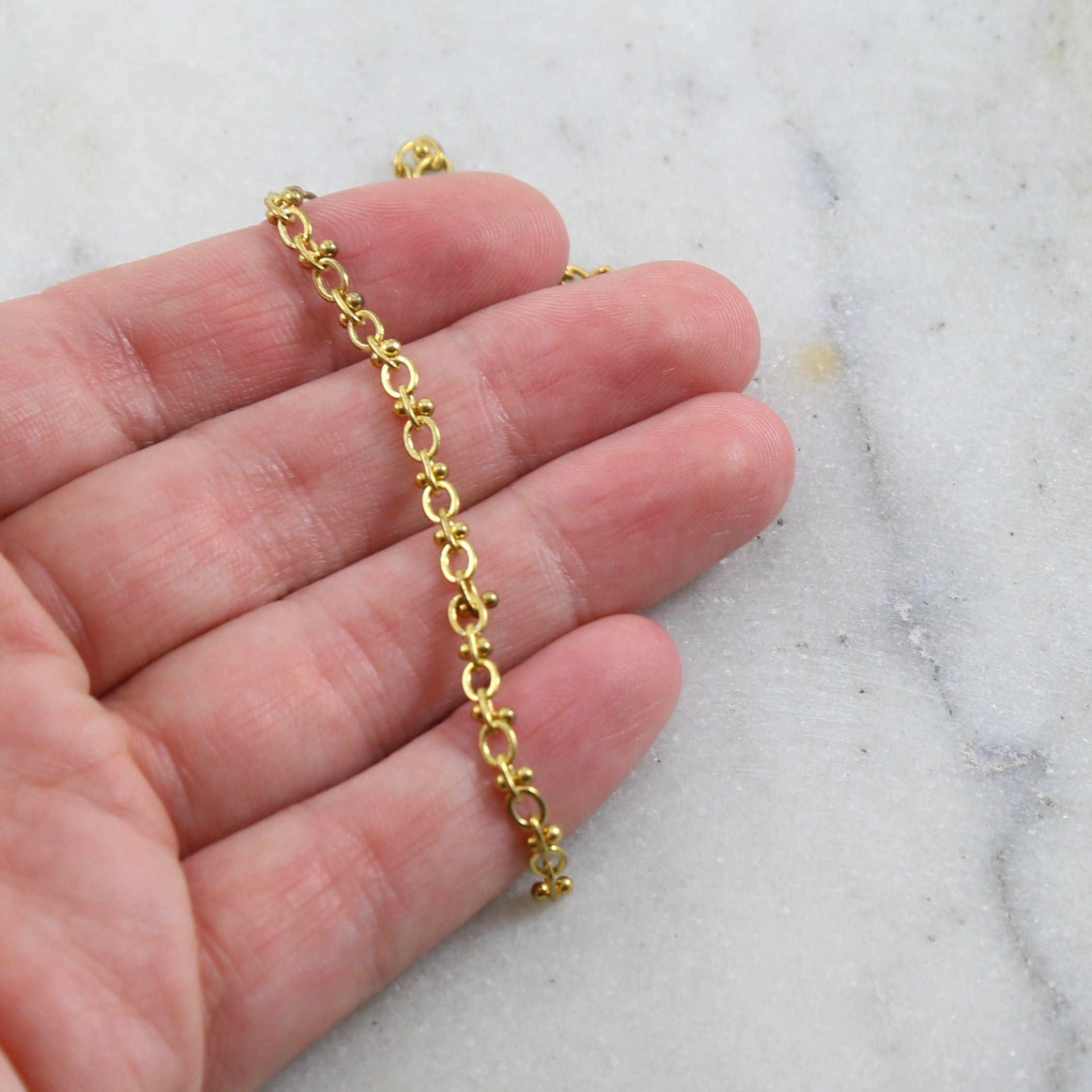 2.5mmx3mm Brass Chain Small Oval with Decorate Barbells – Sold by the Foot