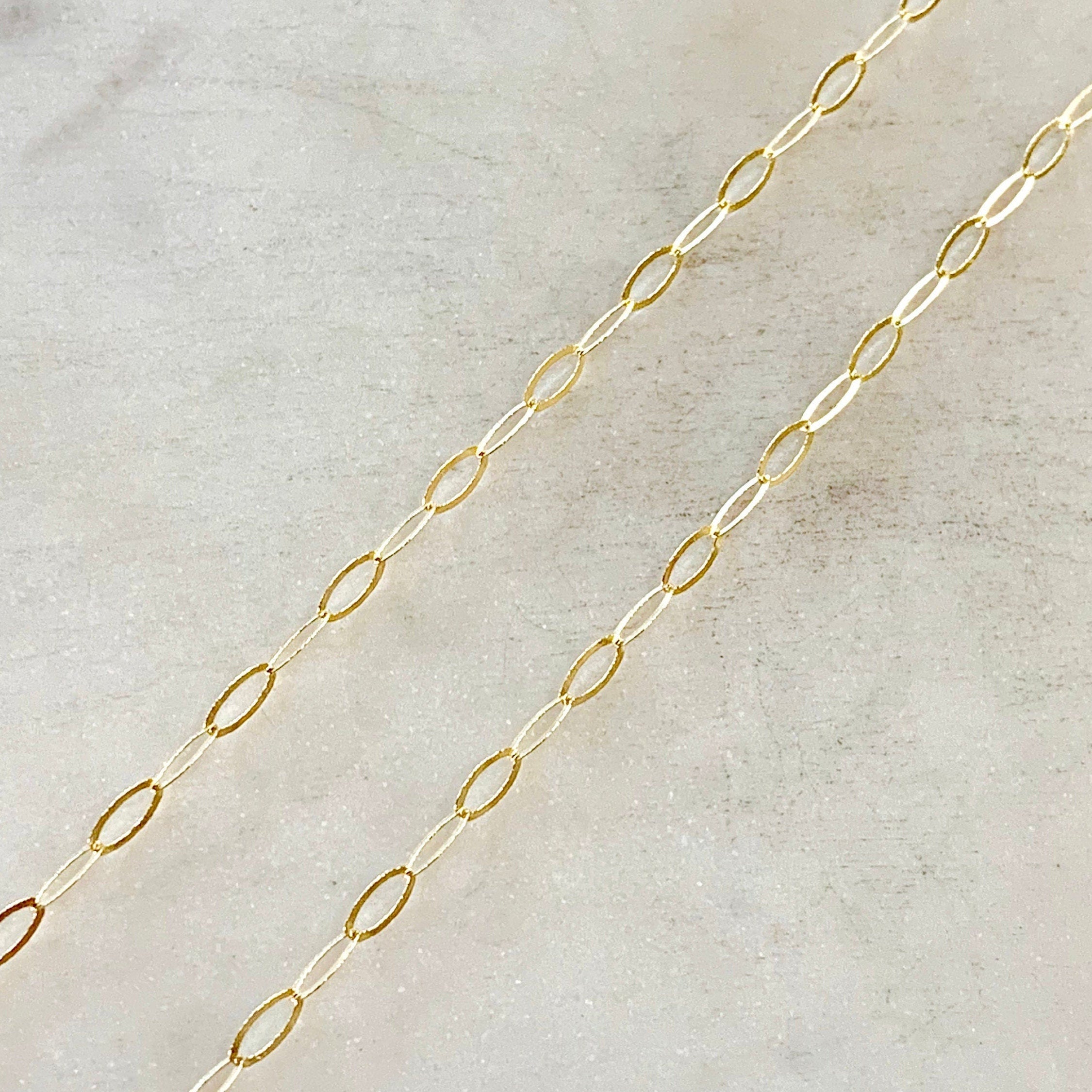 14K Gold Filled 5.7mm x 2.8mm Chain Flat Hammered Oval – Sold by the Foot